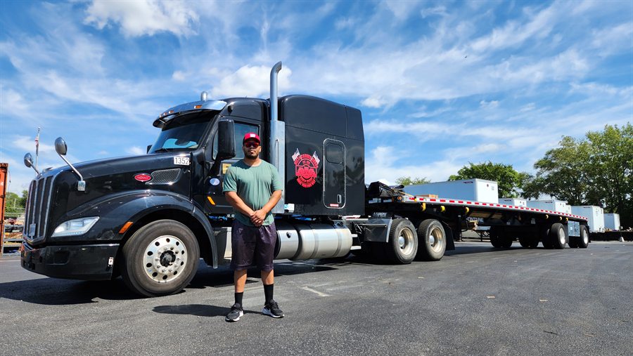 Delta Carrier Group black Peterbilt 579 unit 1352 yard