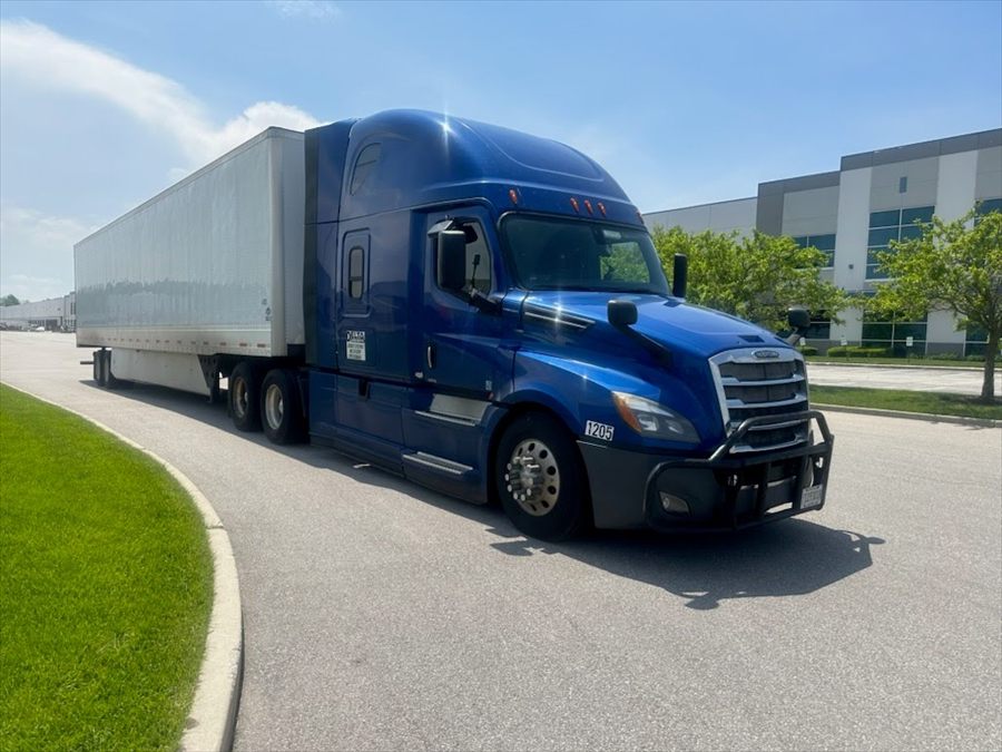 Delta Carrier Group blue Freightliner Cascadia unit 1205 parking