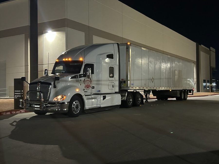 Delta Carrier Group white Kenworth T680 unit 1397 dock
