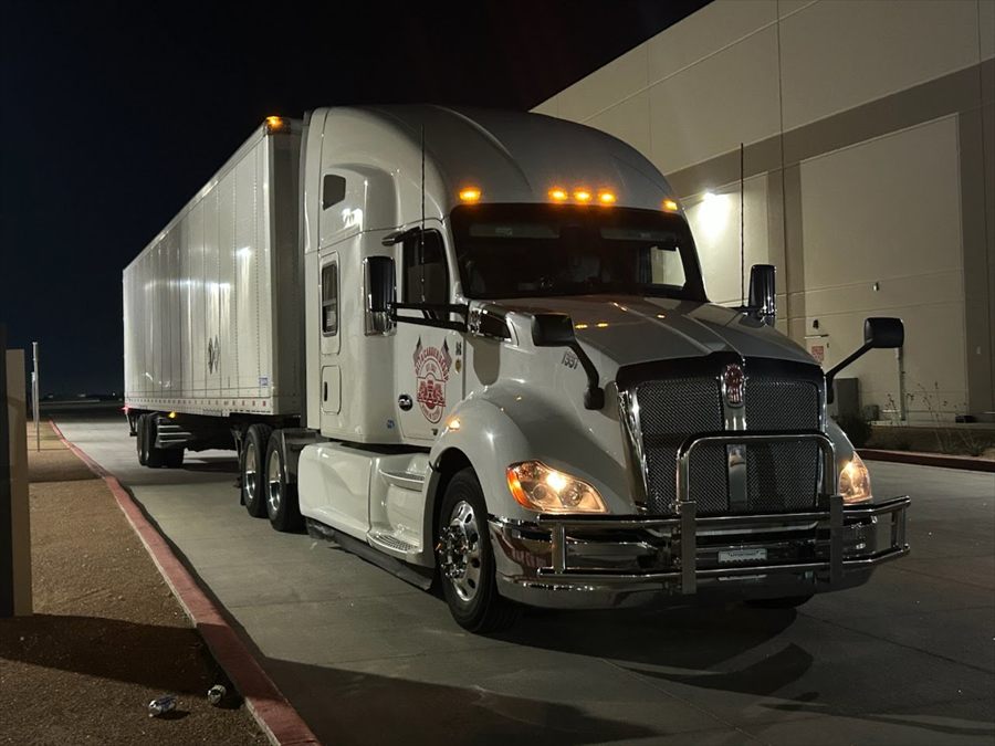 Delta Carrier Group white Kenworth T680 unit 1331 dock