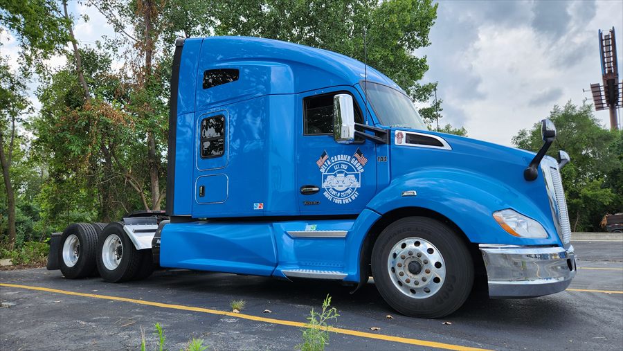 Delta Carrier Group blue Kenworth T680 unit 144 parking