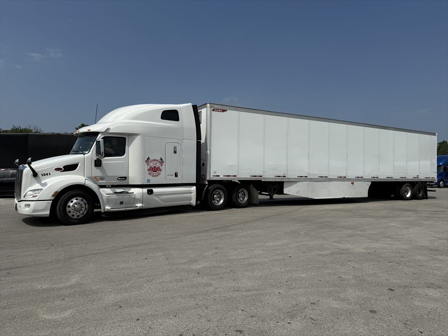 Delta Carrier Group white Peterbilt 579 unit 1341 yard