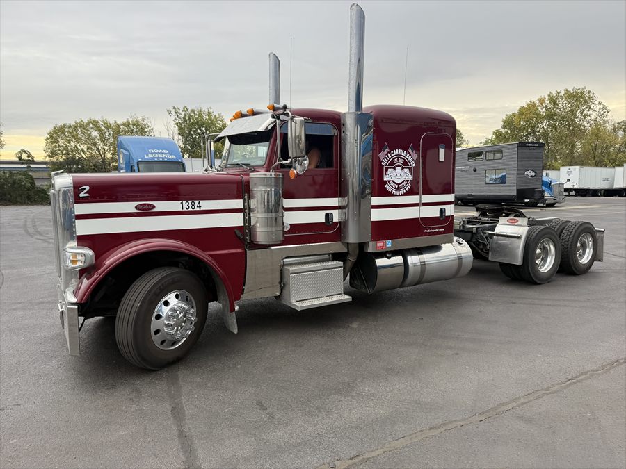 Delta Carrier Group maroon/burgundy with white stripes Peterbilt 389 unit 1384 yard