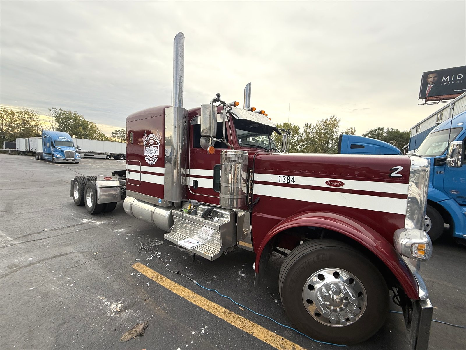 Classic long-hood Peterbilt with Delta Carrier Group badge, unit 1384