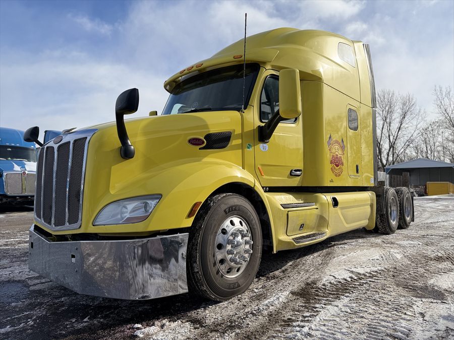 Delta Carrier Group yellow Peterbilt 579 yard