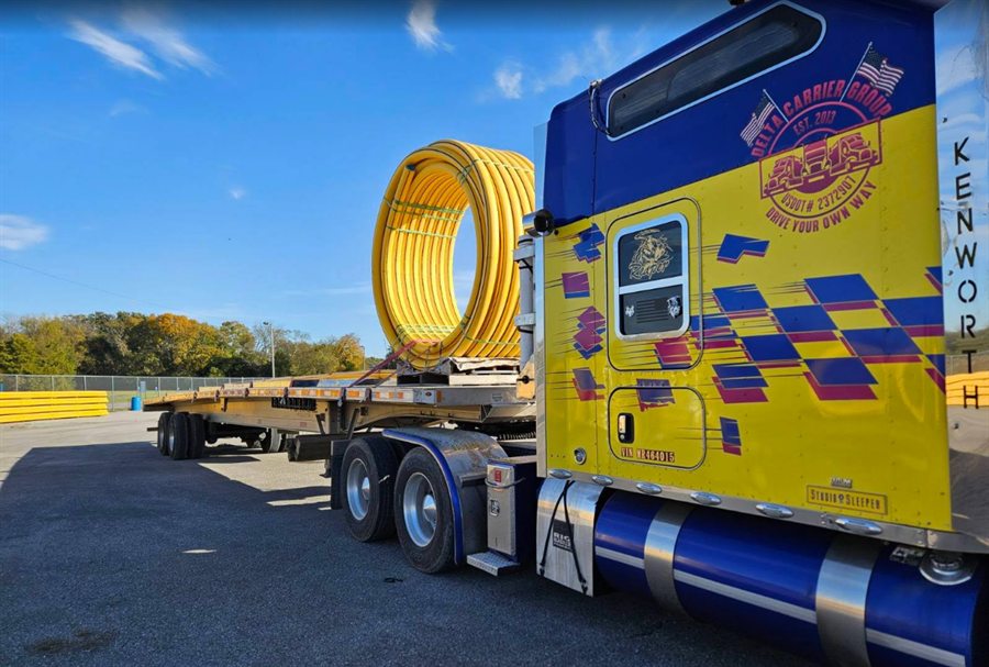 Delta Carrier Group yellow with blue graphics Kenworth W900 unit 1374 parking