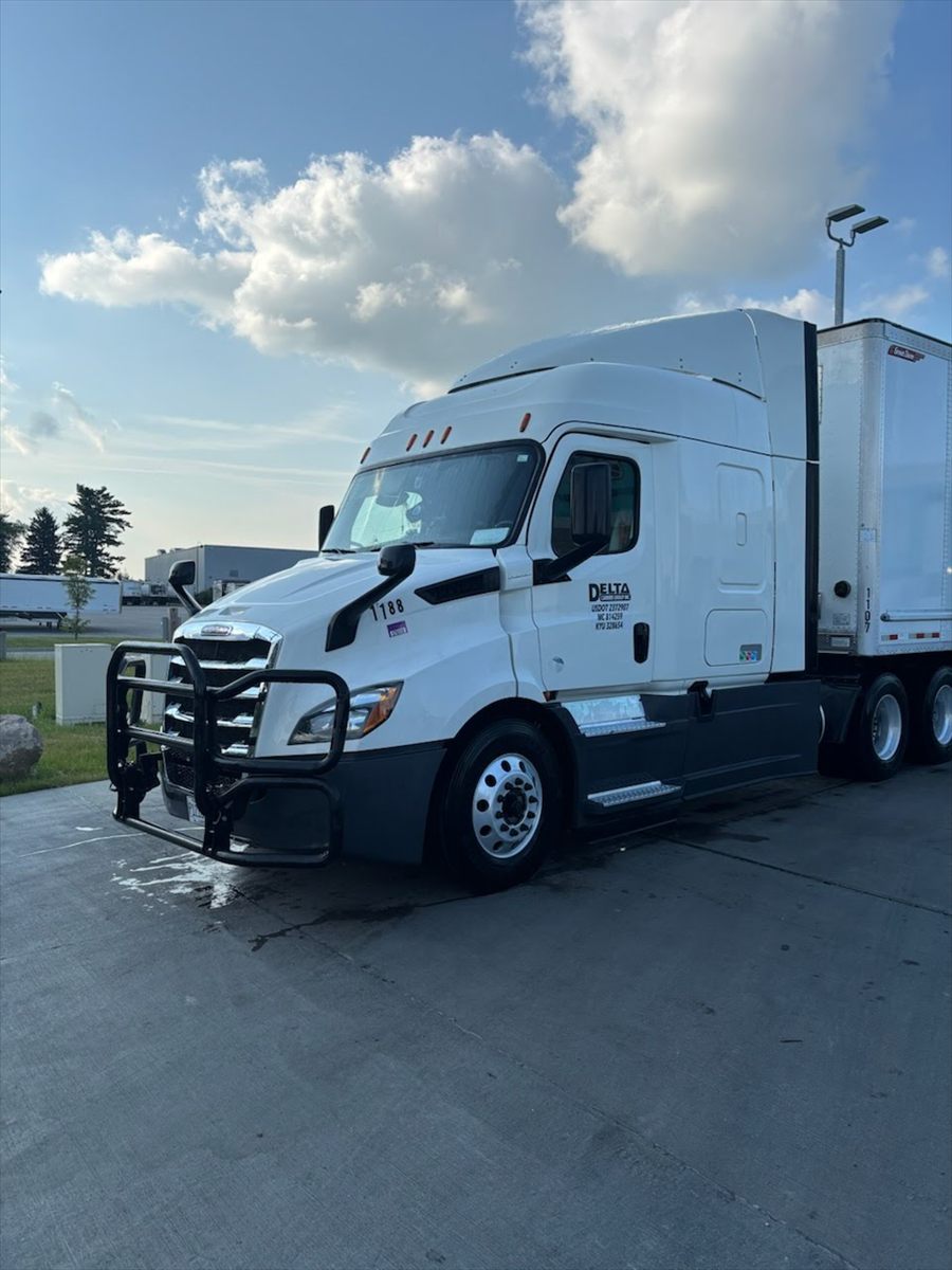 Delta Carrier Group white Freightliner Cascadia (new gen) unit 1188 parking