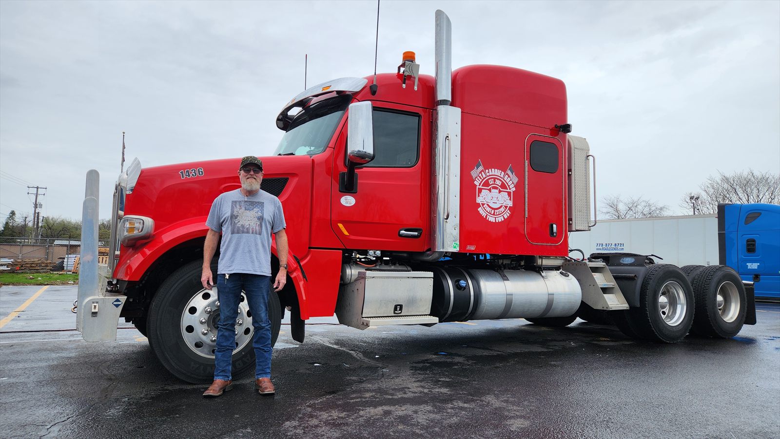 Delta driver Johnny with his red Peterbilt, unit 1436