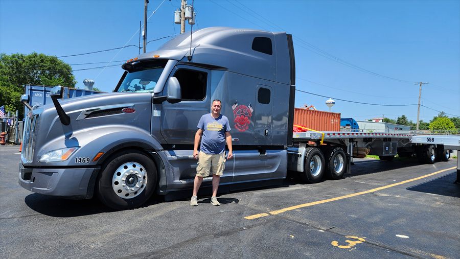 Delta Carrier Group silver-grey Peterbilt 579 unit 1469 yard