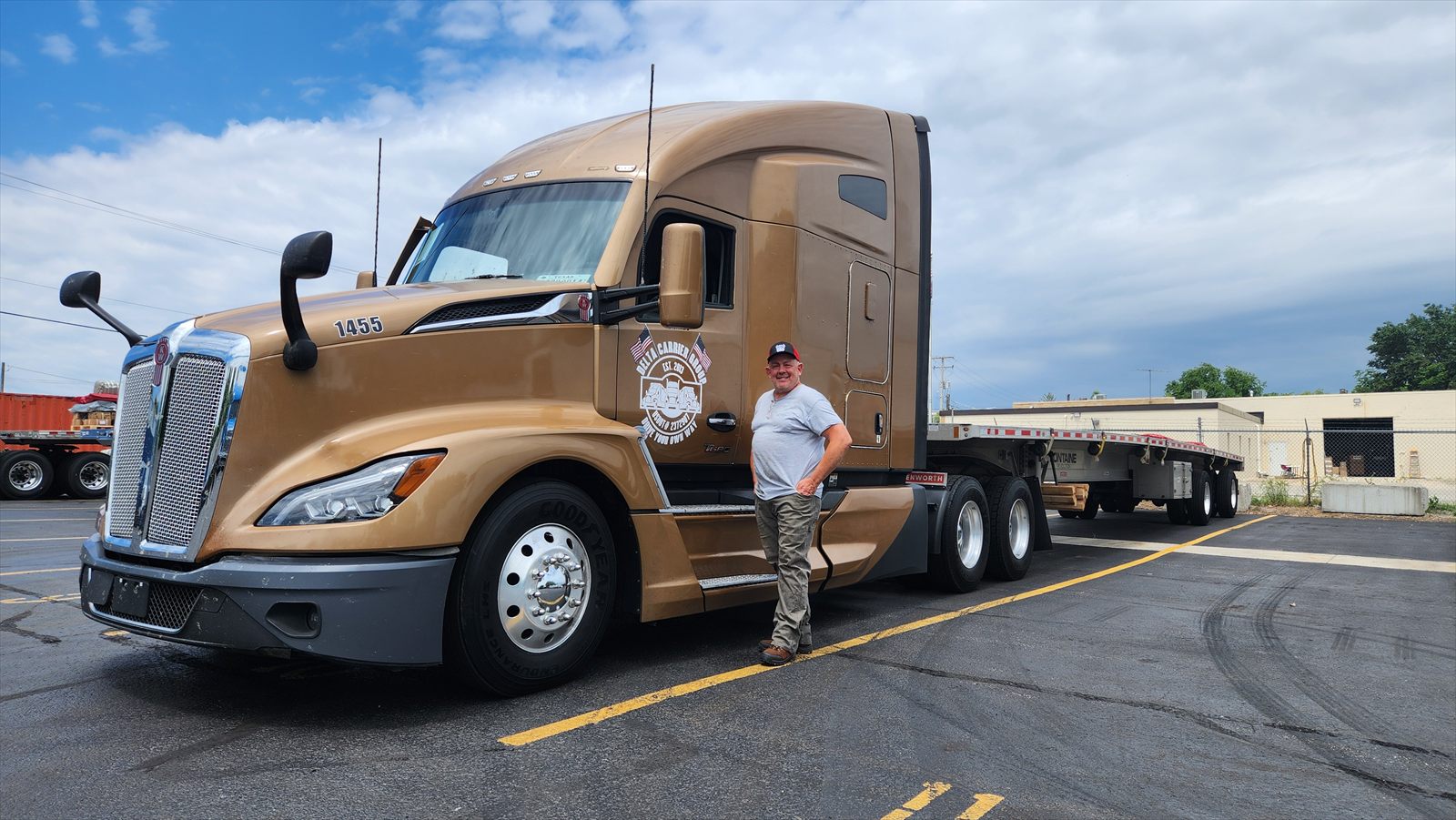 Delta driver Ronald Sammons with his Kenworth T680 and flatbed trailer, unit 1455