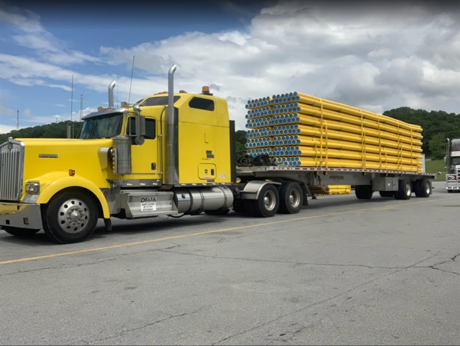 Delta Carrier Group yellow Kenworth W900 unit 1315 parking